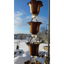 Chaine de gouttiere cuivre sur recuperateur d'eau de pluie